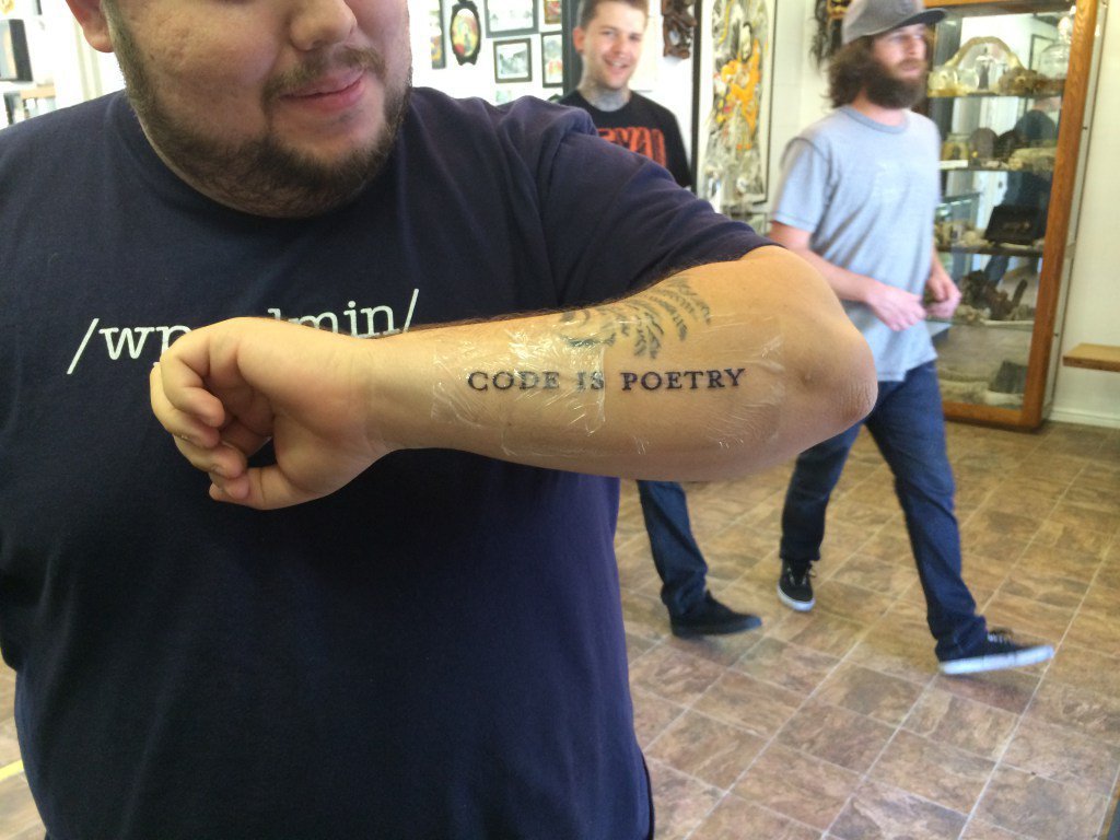 "code is poetry" tattoo