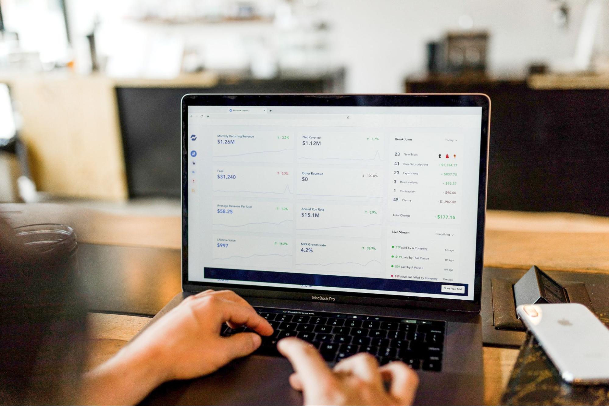 reviewing analytics and data on a laptop
