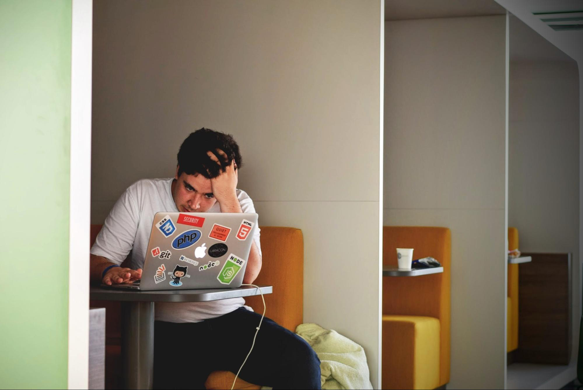 frustrated developer working on a laptop