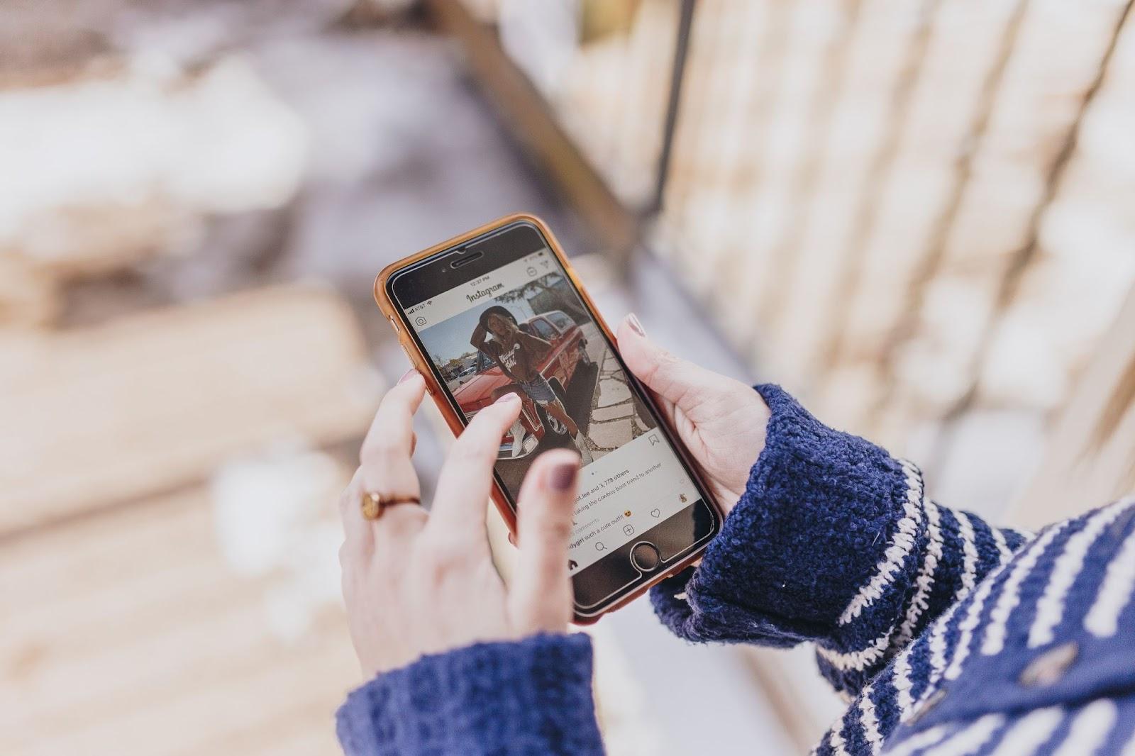 woman scrolling through her Instagram feed