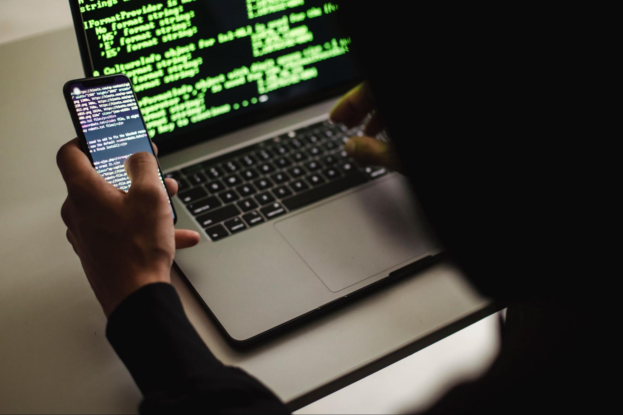 someone working on code on a laptop
