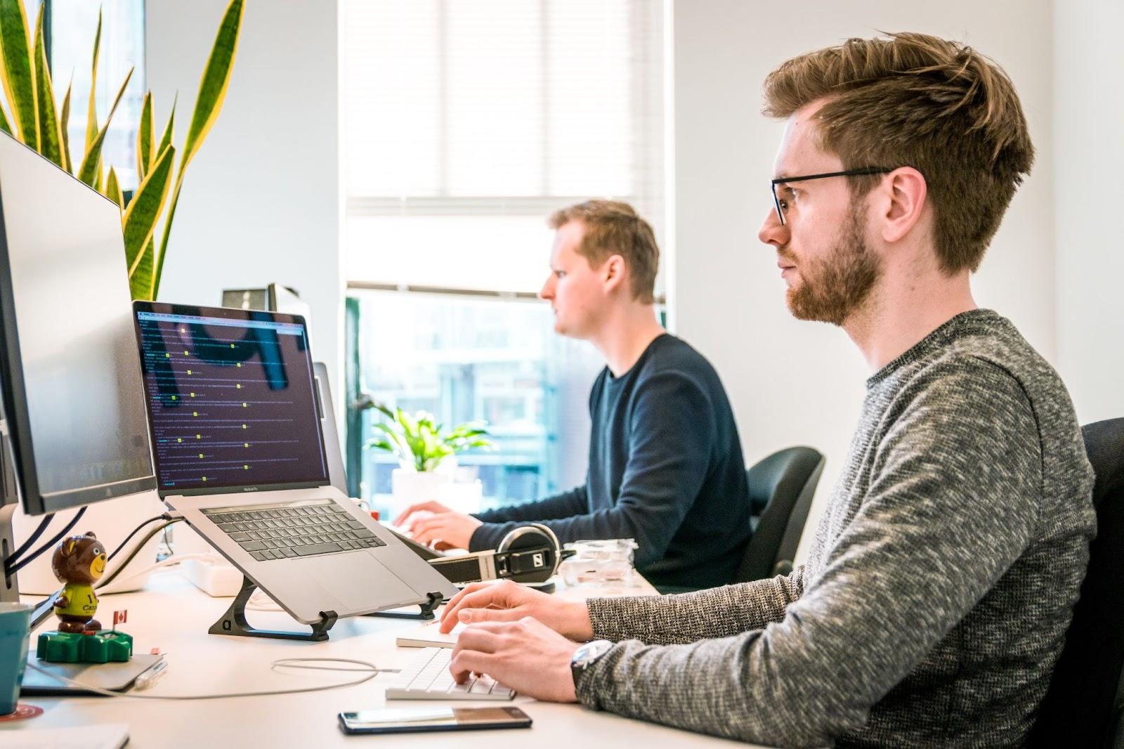 A support team working on laptops