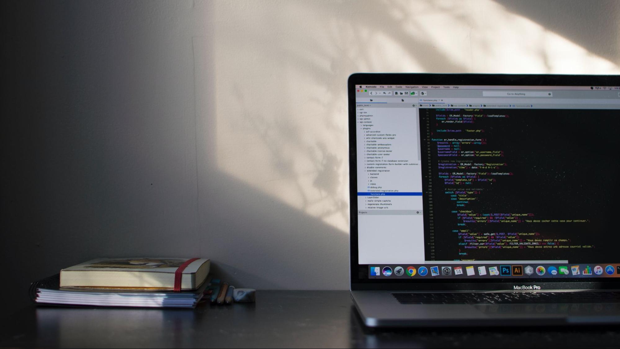 laptop computer with lines of code