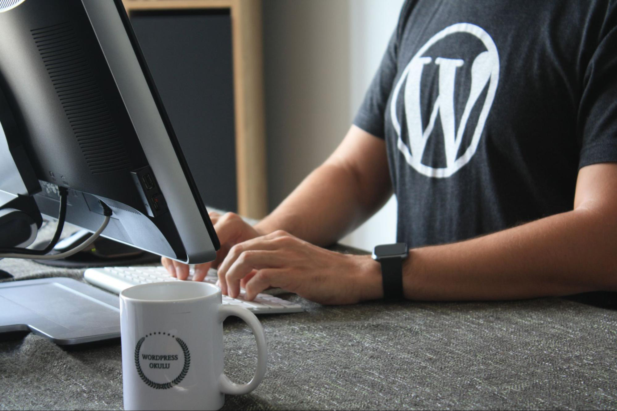 WordPress Developer wearing a black shirt with the WordPress logo
