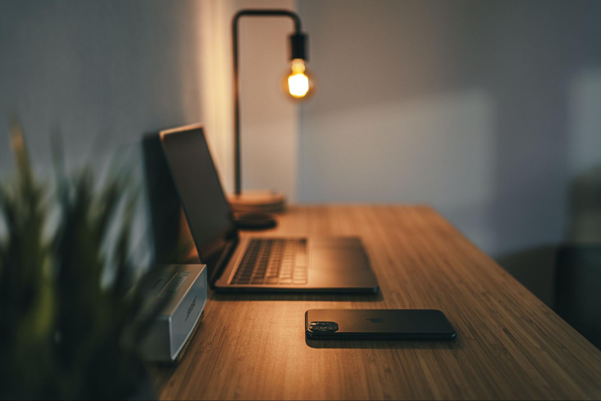 several devices on a wooden desk