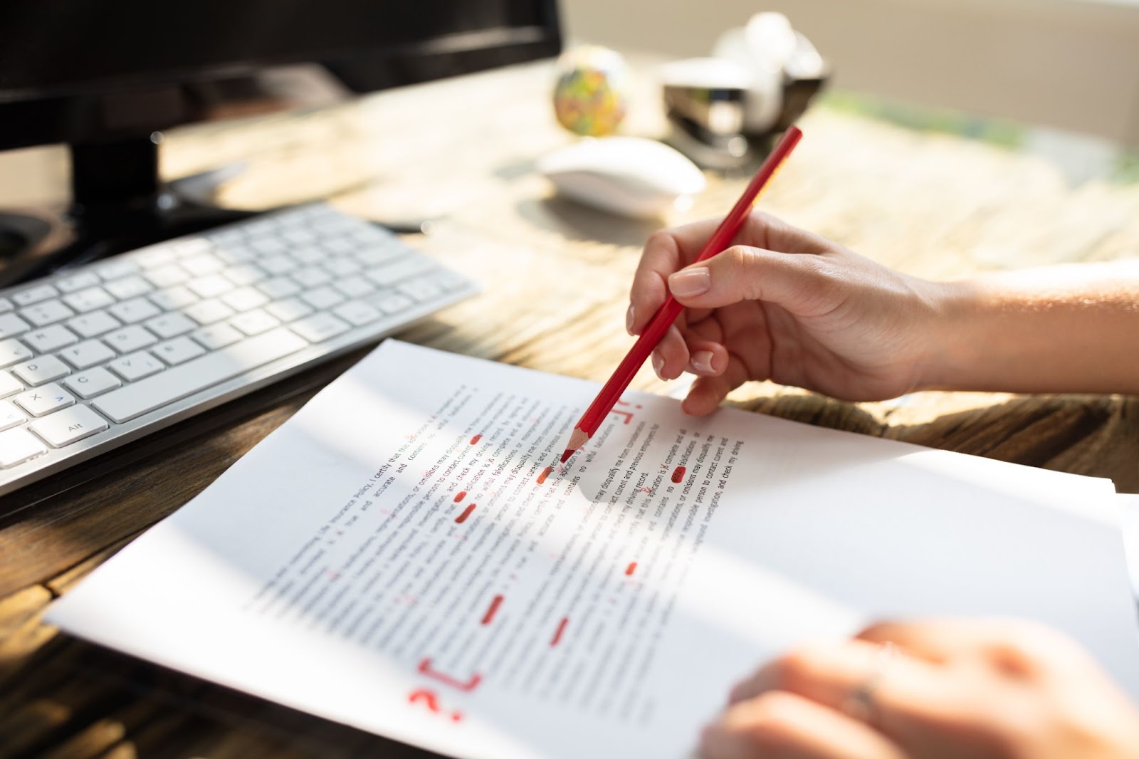 someone editing a printed document