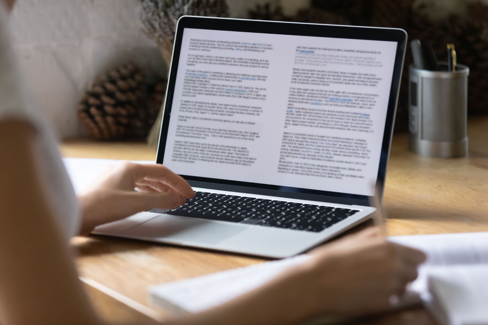 someone editing pages of content on a laptop