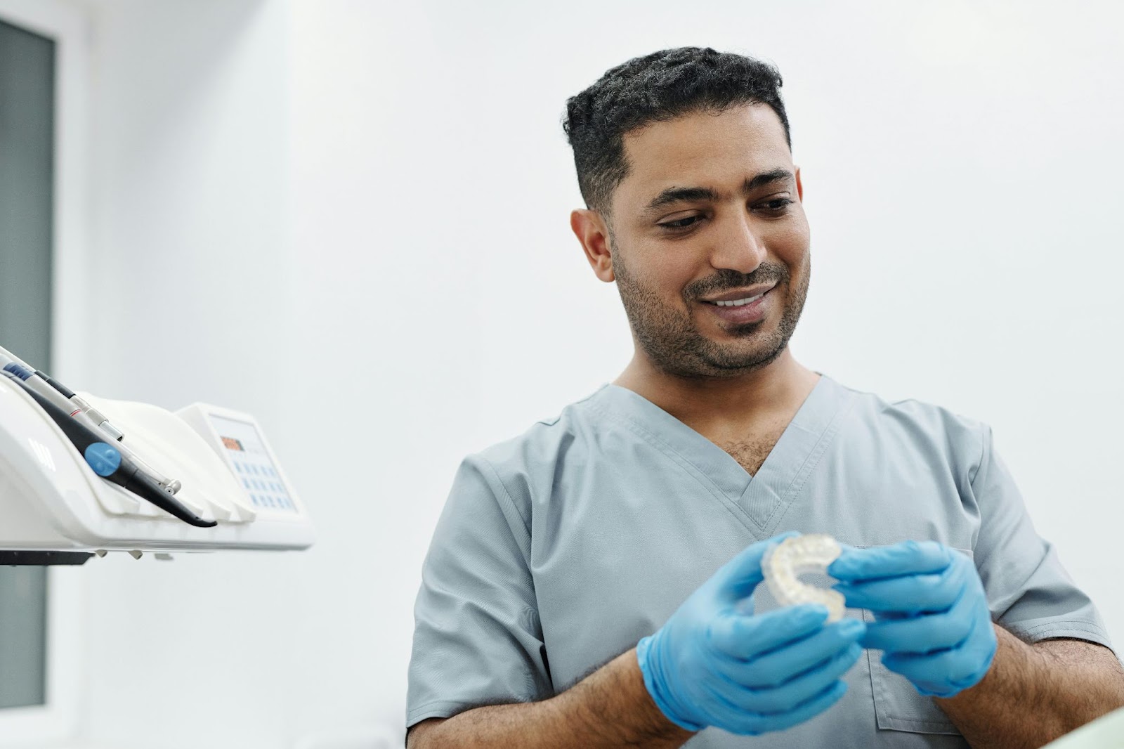 Dentist demonstrating treatment concepts to patient for easier at home care.
