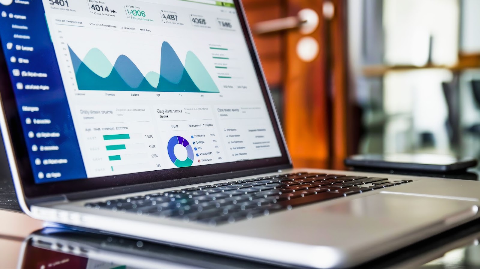laptop with graphs of information