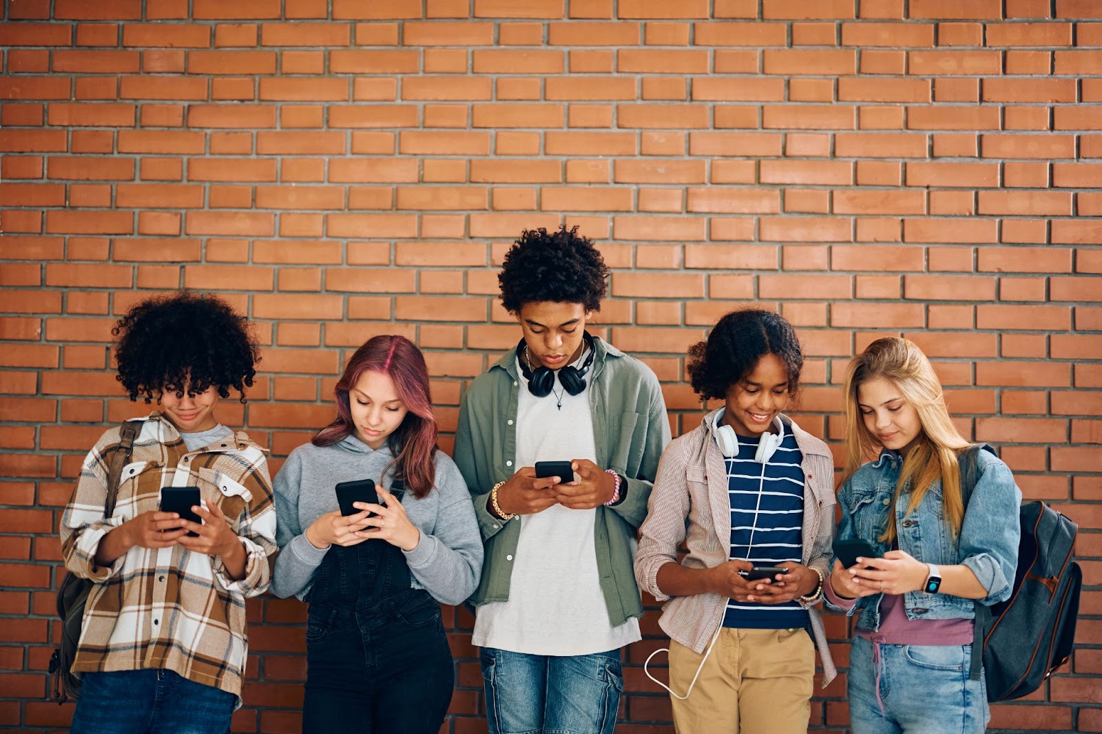 group of students looking at their phones