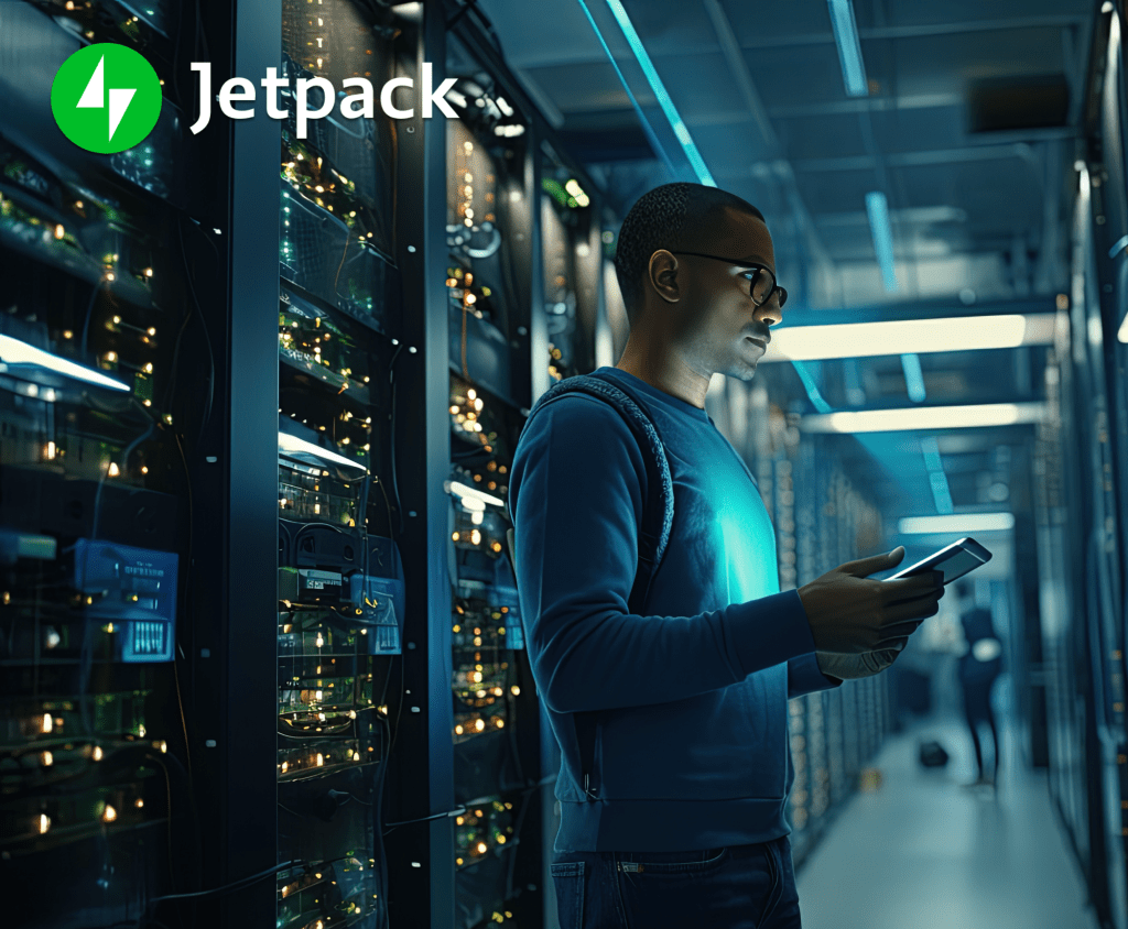 Man standing in front of a server rack.