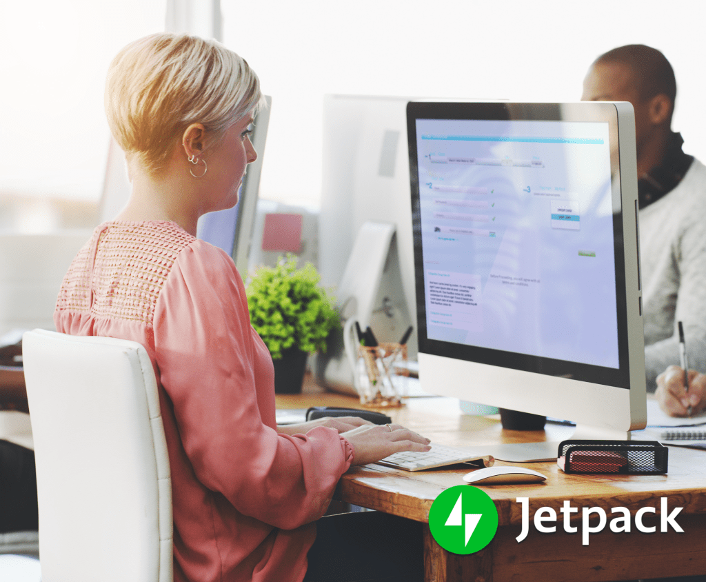 woman working at a desktop comuter