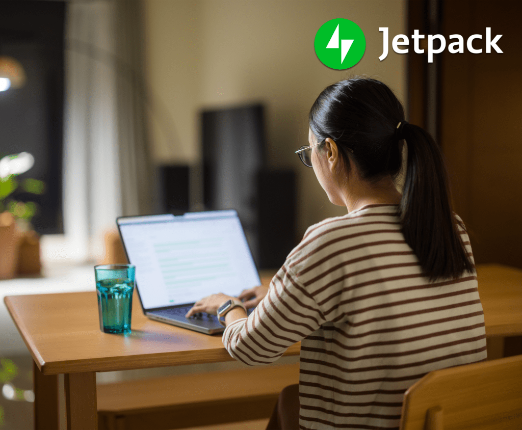 woman in a striped shirt working on a computer