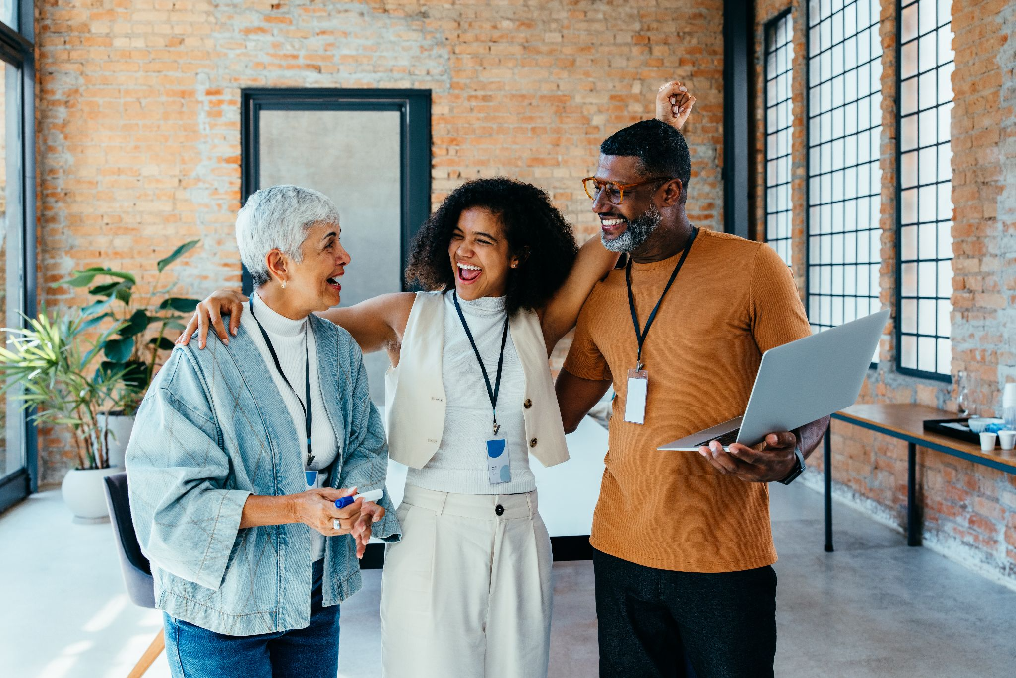 three team members excited about a product launch