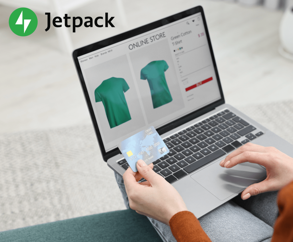 Person purchasing a green shirt with a credit card on their laptop.