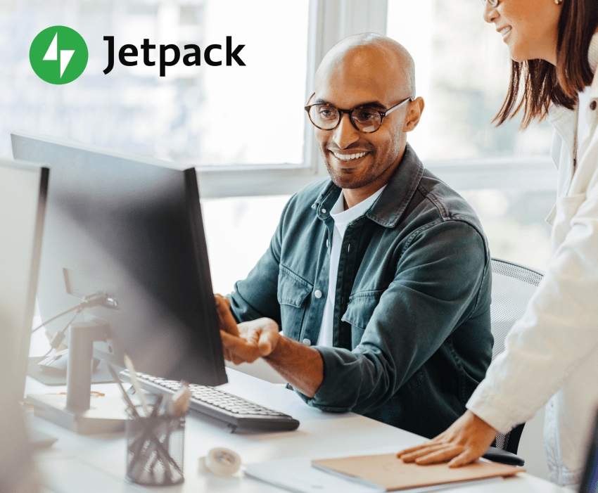 two people working on a computer