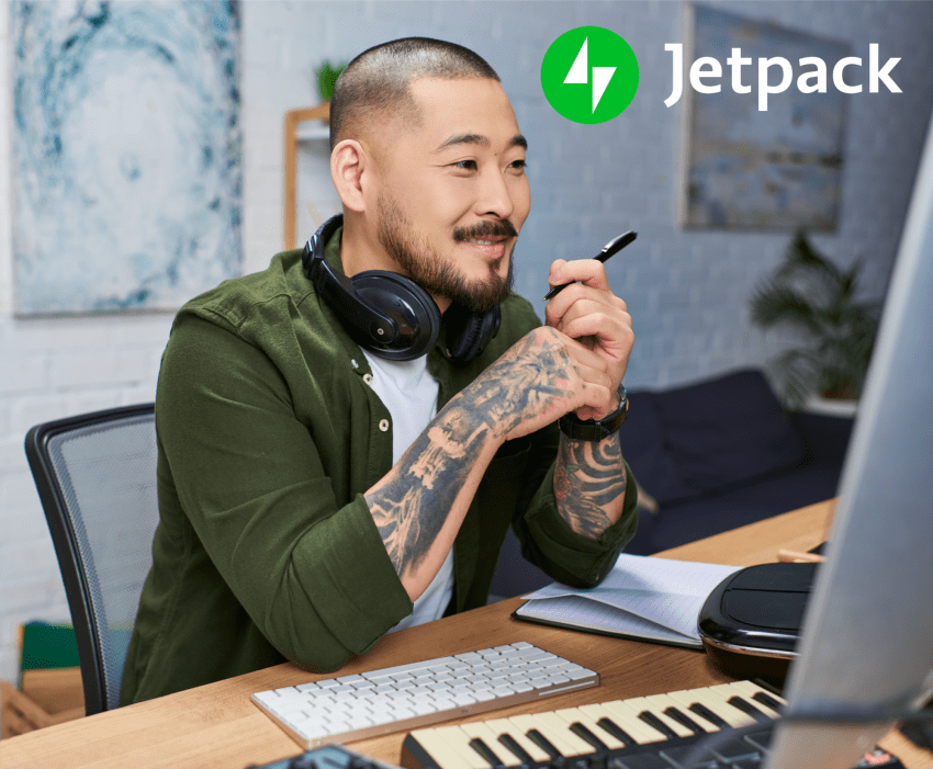 man working on music on a computer