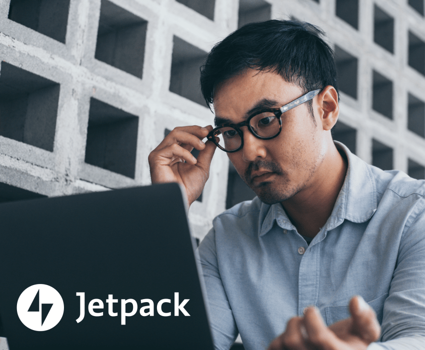 frustrated man looking at a laptop