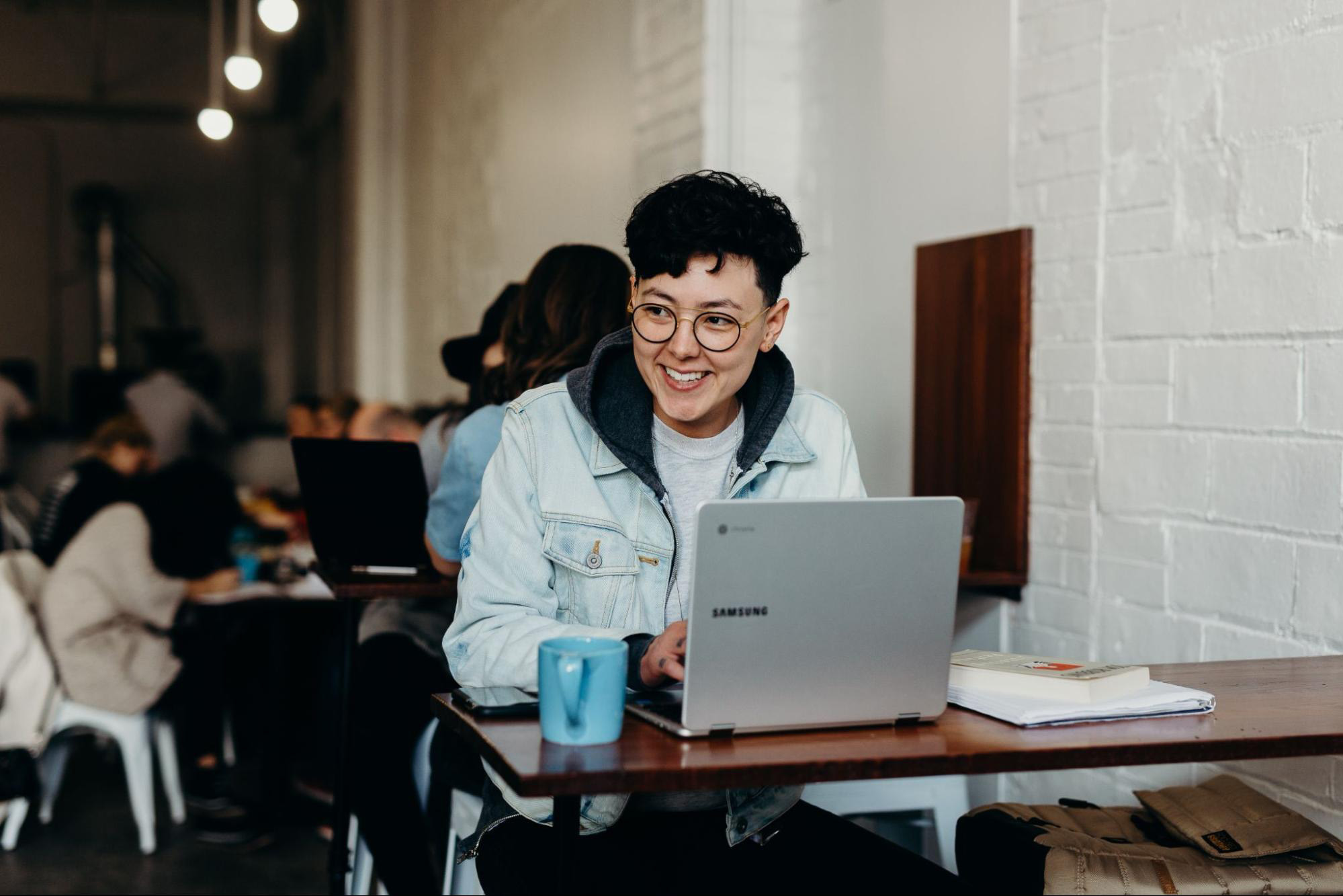 person using a laptop at a coffee shop